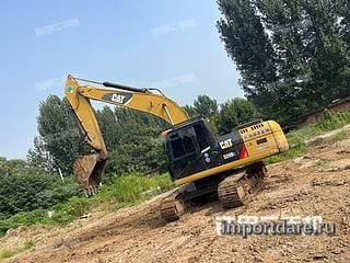 Caterpillar CAT®320 сбоку