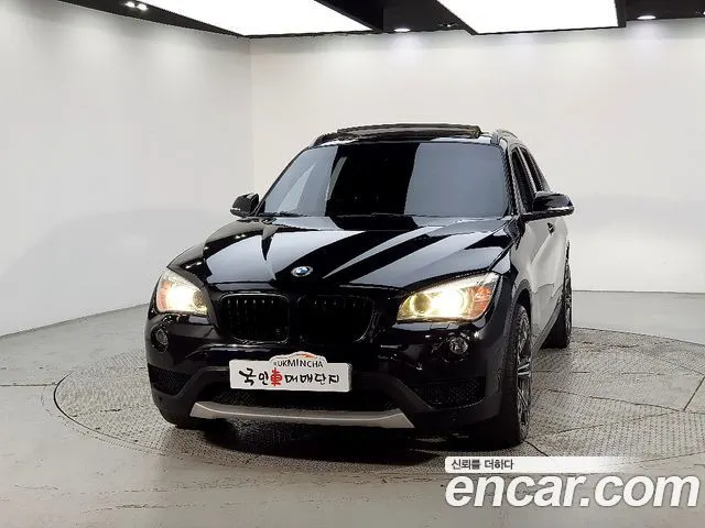 BMW X1 2013 — 142 000 км, чёрный, Корея — под ключ — фото 1