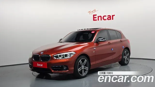 BMW 1 SERIES 2018 — 109 416 км, оранжевый, Корея — под ключ — фото 1